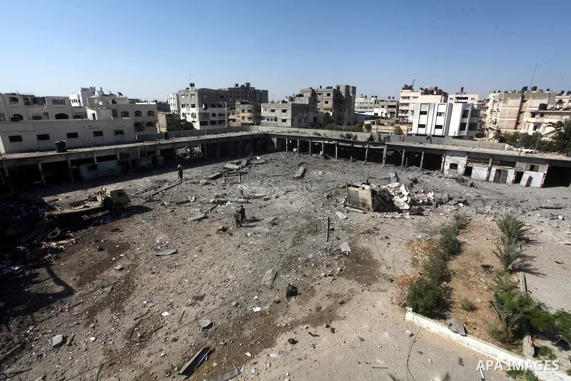 Palestinian Hamas security personnel inspect the damage at al-Saraya Security complex in the centre of Gaza City on June 23, 2012 as Israel launched fresh air strikes on the Gaza Strip overnight after killing two people...
