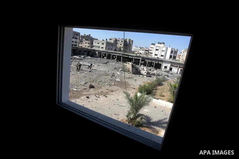 Palestinian Hamas security personnel inspect the damage at al-Saraya Security complex in the centre of Gaza City on June 23, 2012 as Israel launched fresh air strikes on the Gaza Strip overnight after killing two people...