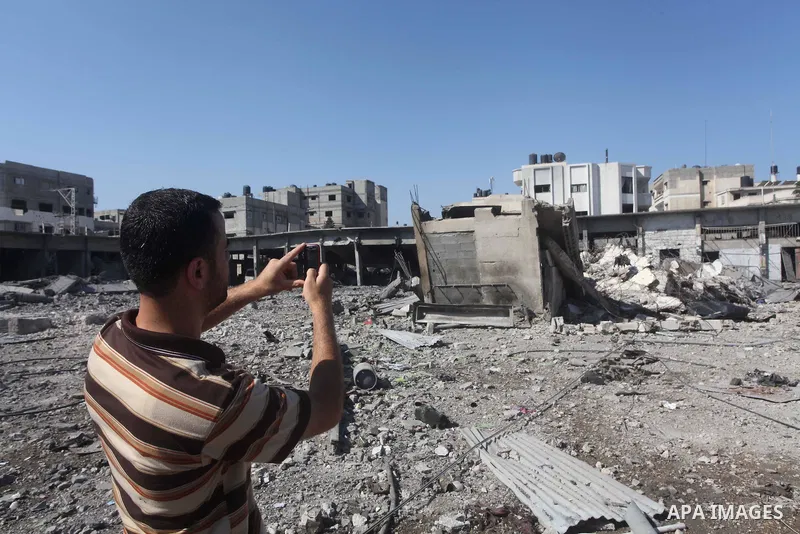 A Palestinian man looks the damage at al-Saraya Security complex in the centre of Gaza City on June 23, 2012 as Israel launched fresh air strikes on the Gaza Strip overnight after killing two people in earlier raids. The...