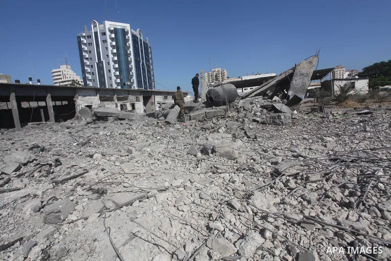 Palestinian Hamas security personnel inspect the damage at al-Saraya Security complex in the centre of Gaza City on June 23, 2012 as Israel launched fresh air strikes on the Gaza Strip overnight after killing two people...