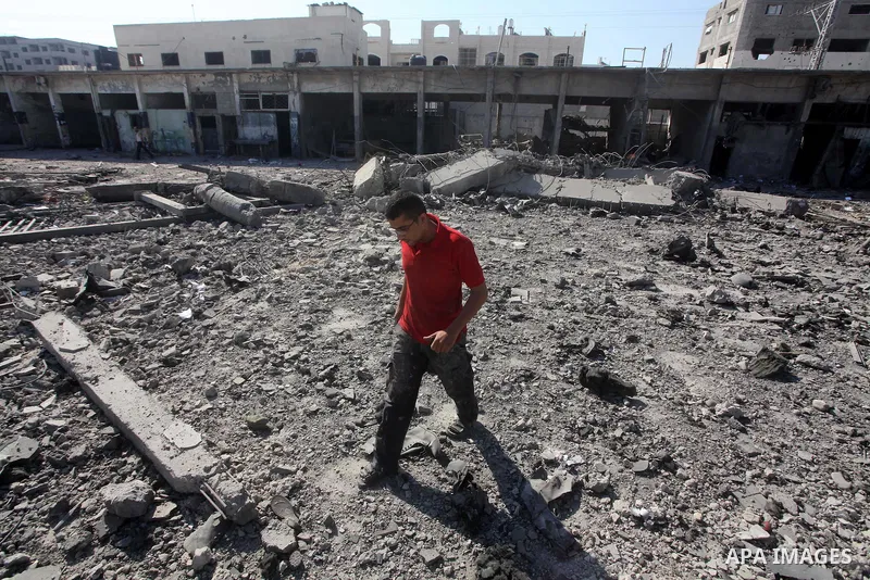 Palestinian Hamas security personnel inspect the damage at al-Saraya Security complex in the centre of Gaza City on June 23, 2012 as Israel launched fresh air strikes on the Gaza Strip overnight after killing two people...