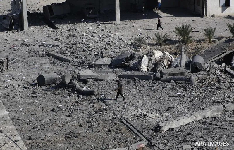 Palestinian Hamas security personnel inspect the damage at al-Saraya Security complex in the centre of Gaza City on June 23, 2012 as Israel launched fresh air strikes on the Gaza Strip overnight after killing two people...