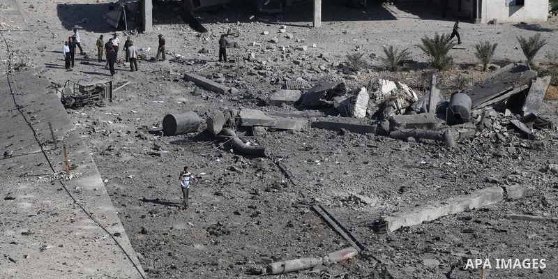 Palestinian Hamas security personnel inspect the damage at al-Saraya Security complex in the centre of Gaza City on June 23, 2012 as Israel launched fresh air strikes on the Gaza Strip overnight after killing two people...
