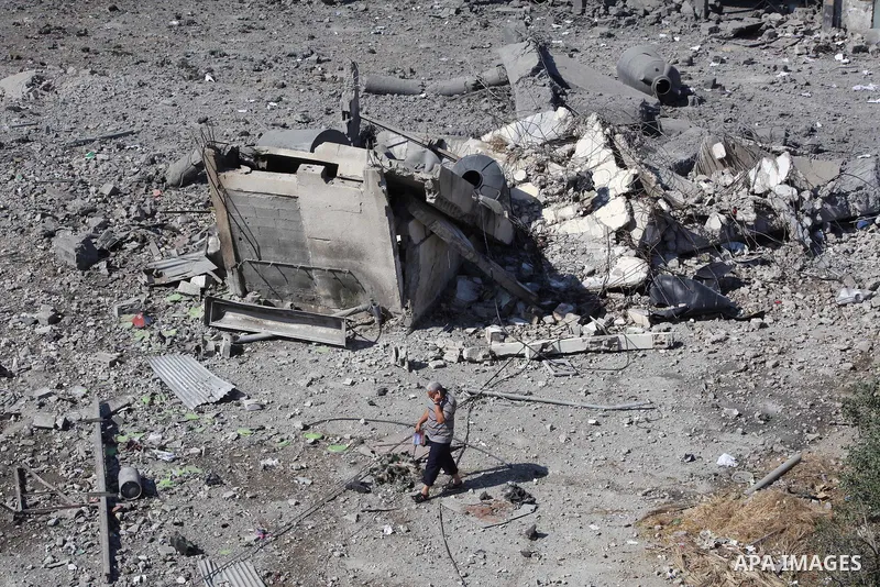 Palestinian Hamas security personnel inspect the damage at al-Saraya Security complex in the centre of Gaza City on June 23, 2012 as Israel launched fresh air strikes on the Gaza Strip overnight after killing two people...