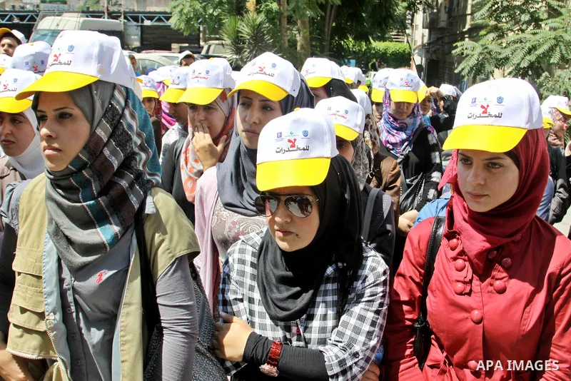 Palestinians wearing hats with the slogan " no for drugs" march in the streets of the West Bank city of Nablus on June 23, 2012 as part of an awareness campaign, entitled "fighting drug", against the consumption of narco...