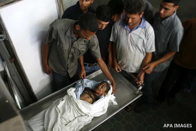 The body of a Palestinian six-year-old boy Ali Al-Shwaf is shown to the media as they prepare his body for burial at the Nasser hospital morgue in Khan Younis, in the southern Gaza Strip June 23, 2012. Hamas medical offi...