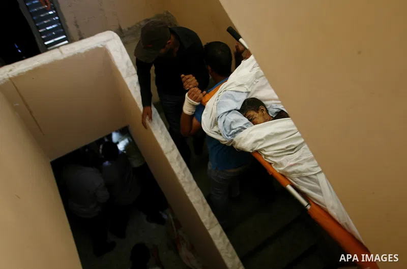 Palestinian mourners carry the body of 6-year-old Ali al-Shwaf during his funeral in Khan Younis, southern Gaza Strip, Saturday, June 23, 2012. Gaza's militant Hamas rulers threatened to escalate fighting with Israel on...