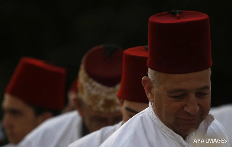 Samaritans attend Shavuot festival on Mount Gerizim near the northern West Bank city of Nablus on June 24, 2012 which is giving of the Torah at Mount Sinai seven weeks after the exodus of the Jewish people from Egypt. Th...