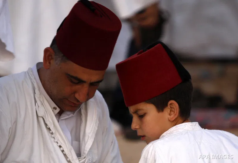 Samaritans attend Shavuot festival on Mount Gerizim near the northern West Bank city of Nablus on June 24, 2012 which is giving of the Torah at Mount Sinai seven weeks after the exodus of the Jewish people from Egypt. Th...
