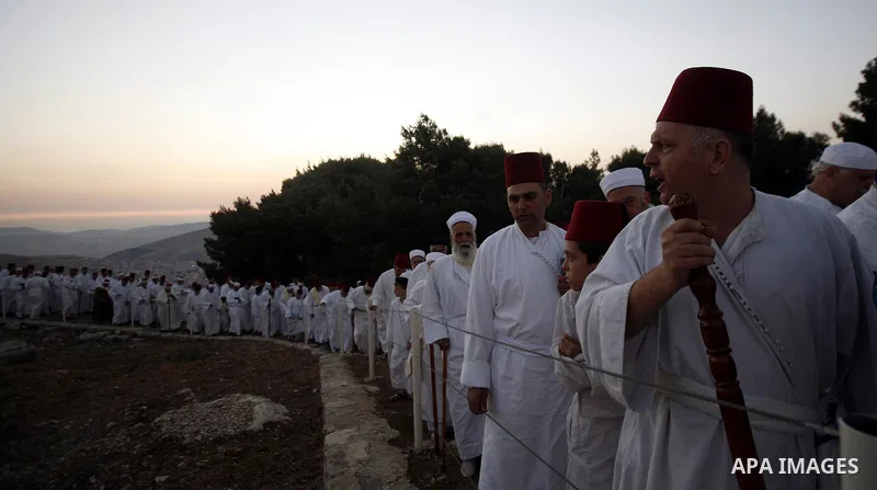 Samaritans attend Shavuot festival on Mount Gerizim near the northern West Bank city of Nablus on June 24, 2012 which is giving of the Torah at Mount Sinai seven weeks after the exodus of the Jewish people from Egypt. Th...