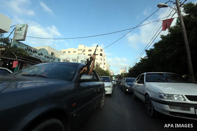 Palestinians hold national and Egyptian flags as they celebrate in Gaza City, the victory of Muslim Brotherhood's presidential candidate, Mohamed Morsi, in the Egyptian elections on June 24, 2012. Arab governments and le...