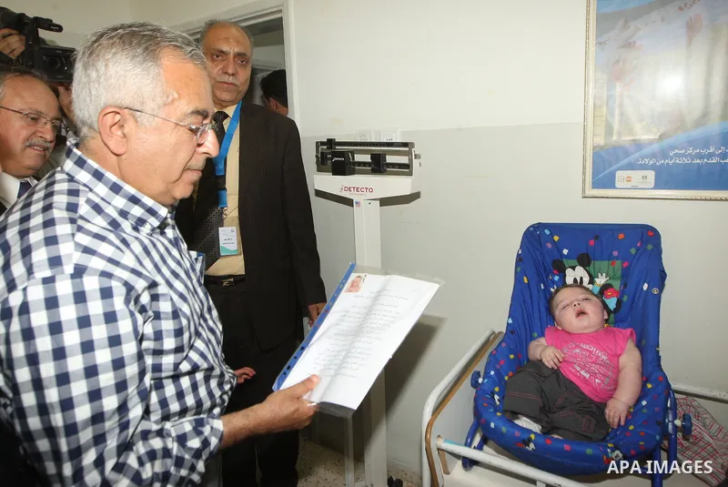 Palestinian Prime Minister, Salam Fayyad attends the opening of several centers in Hebron, in the West Bank of Hebron on June 24, 2012. Photo by Mahmoud Hrebat