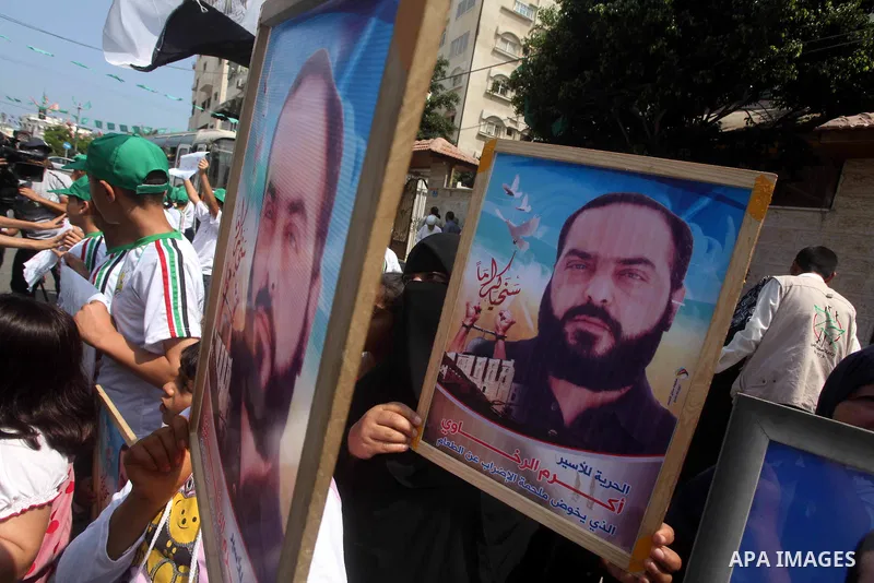 Palestinians gather during a protest in front of the Red Cross' offices in Gaza City to calling of release of palestinian prisoners on June, 25, 2012. Photo by Ashraf Amra