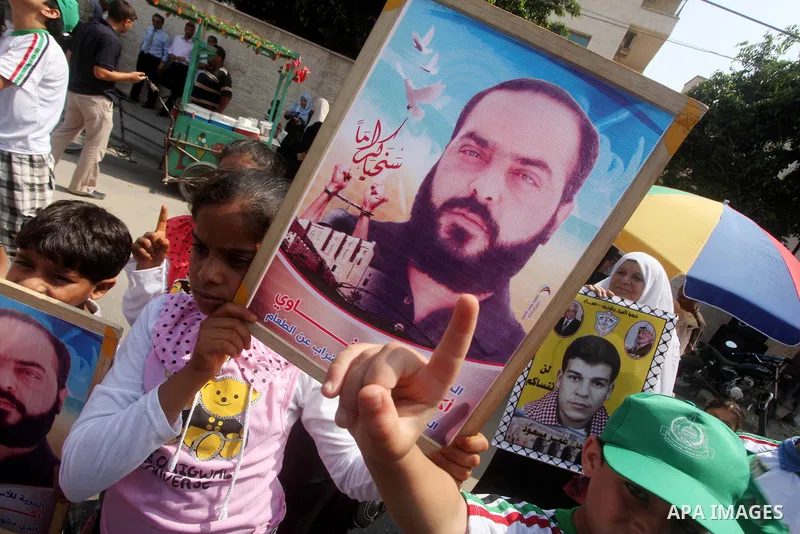 Palestinians gather during a protest in front of the Red Cross' offices in Gaza City to calling of release of palestinian prisoners on June, 25, 2012. Photo by Ashraf Amra