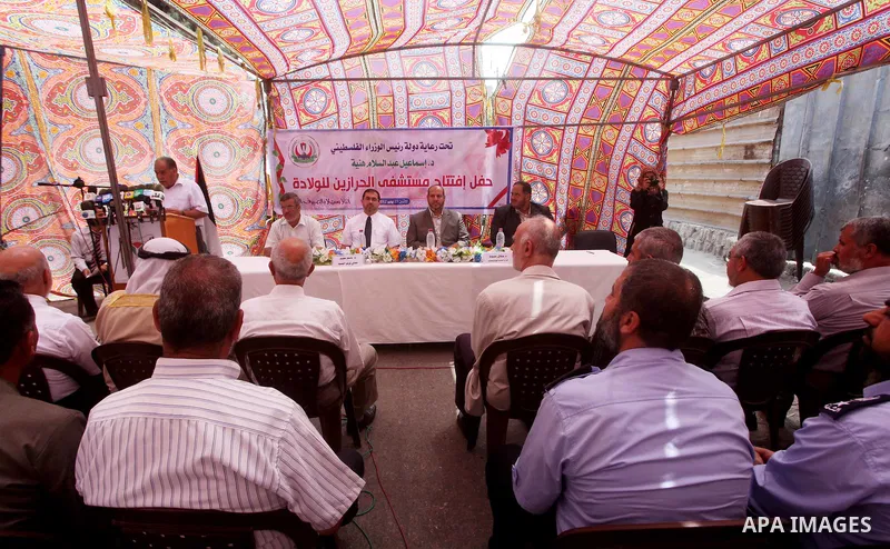 Palestinian doctors take part in the opening of the Al Harazin hospital generation in Gaza City on June, 25, 2012. Photo by Ashraf Amra.