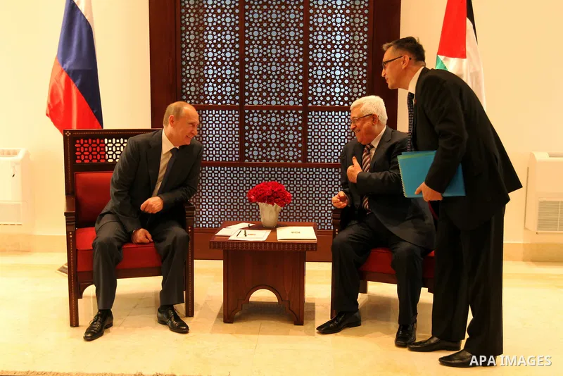 Palestinian President Mahmoud Abbas meets with his Russian counterpart Vladimir Putin at his office in the West Bank city of Bethlehem on June 26, 2012./Pool/Luay Sababa