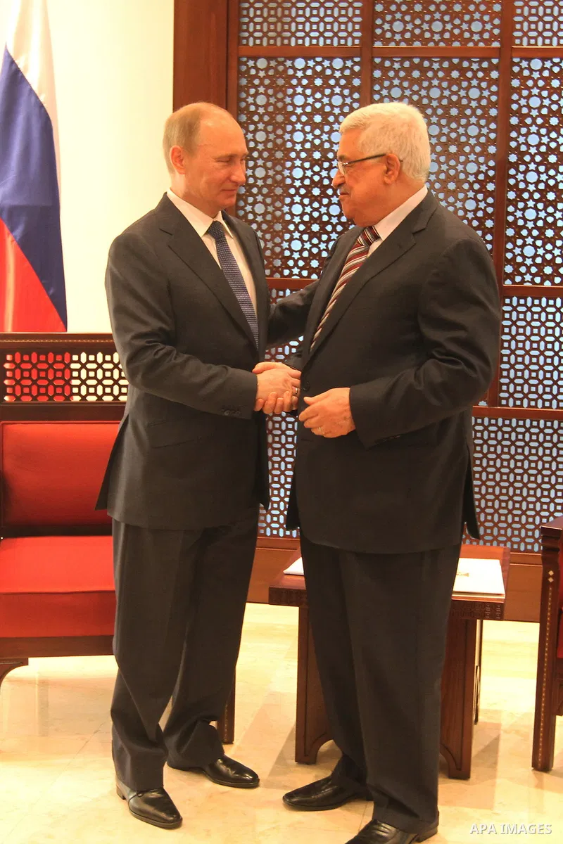 Palestinian President Mahmoud Abbas meets with his Russian counterpart Vladimir Putin at his office in the West Bank city of Bethlehem on June 26, 2012./Pool/Luay Sababa