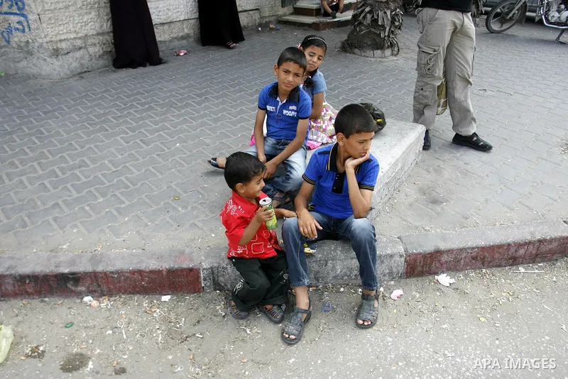 Palestinian children sit in the streets Rafah, southern Gaza Strip on June 26, 2012. The European Union's envoy to the Palestinian Authority confirmed its support and allegiance to the people. Photo by Eyad Al Baba .