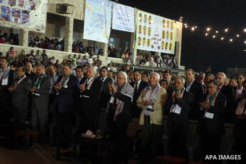 Palestinian President Mahmoud Abbas attends a mass wedding for 19 Groom in the village of Silwad in the West Bank city of Ramallah, June 28, 2012. Photo by Issam Rimawi