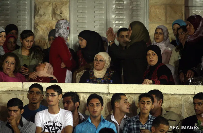 Palestinians celebrate during a mass wedding for 19 Groom, participation of Palestinian President Mahmoud Abbas (not seen) in the village of Silwad in the West Bank city of Ramallah, June 28, 2012. Photo by Issam Rimawi