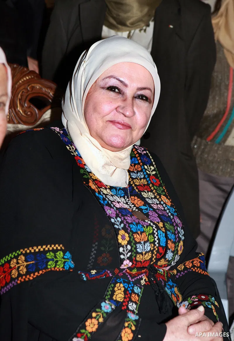 Palestinian President Mahmoud Abbas' wife attends a mass wedding for 19 Groom in the village of Silwad in the West Bank city of Ramallah, June 28, 2012. Photo by Thaer Ganaim