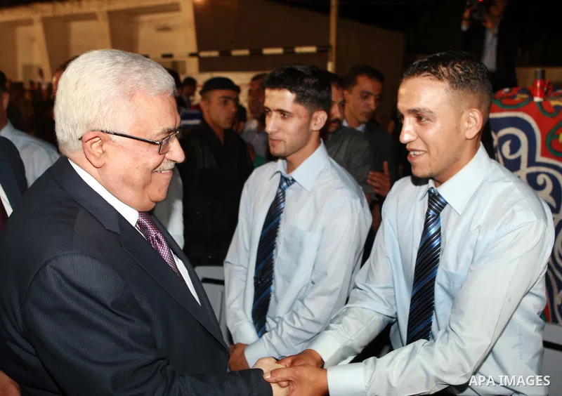 Palestinian President Mahmoud Abbas attends a mass wedding for 19 Groom in the village of Silwad in the West Bank city of Ramallah, June 28, 2012. Photo by Thaer Ganaim