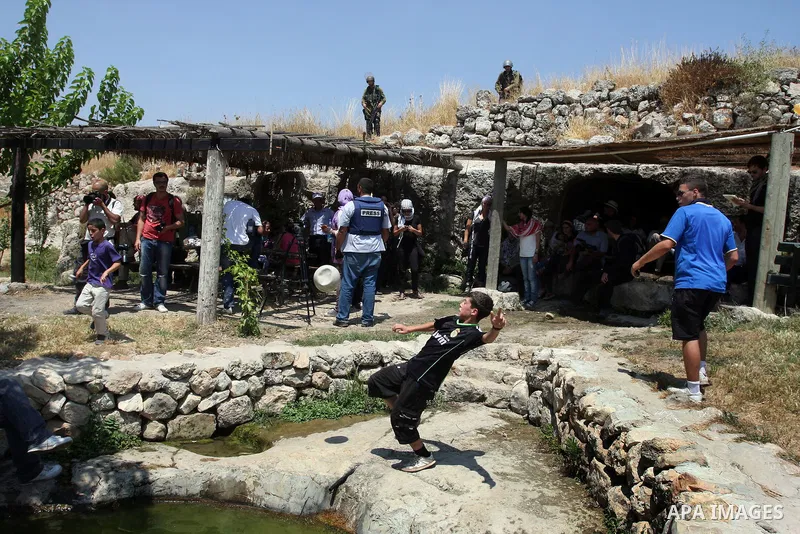 Israeli soldiers confront Palestinian protesters during a demonstration against Israel's separation barrier in the West Bank village of Nabi Saleh near Ramallah, Friday, June 29, 2012. Palestinians protest weekly against...