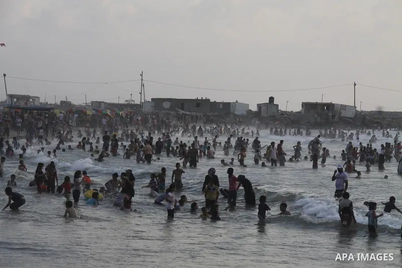 Palestinians enjoy swimming on their week-end in the Mediterranean sea in Gaza City on June 29, 2012. Photo by Majdi Fathi