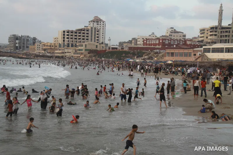 Palestinians enjoy swimming on their week-end in the Mediterranean sea in Gaza City on June 29, 2012. Photo by Majdi Fathi