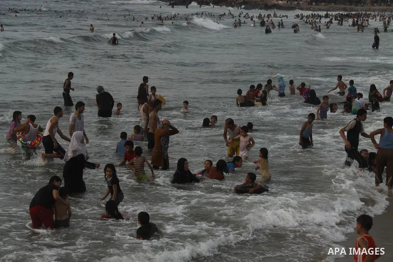 Palestinians enjoy swimming on their week-end in the Mediterranean sea in Gaza City on June 29, 2012. Photo by Majdi Fathi