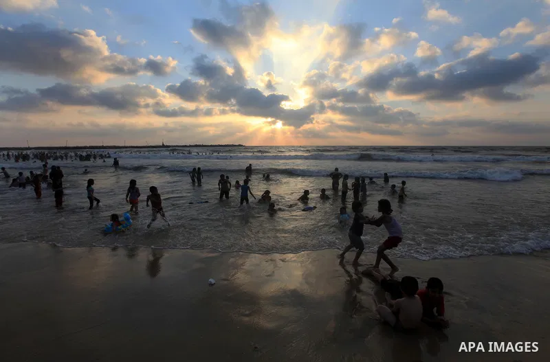 Palestinians enjoy swimming on their week-end in the Mediterranean sea in Gaza City on June 29, 2012. Photo by Majdi Fathi