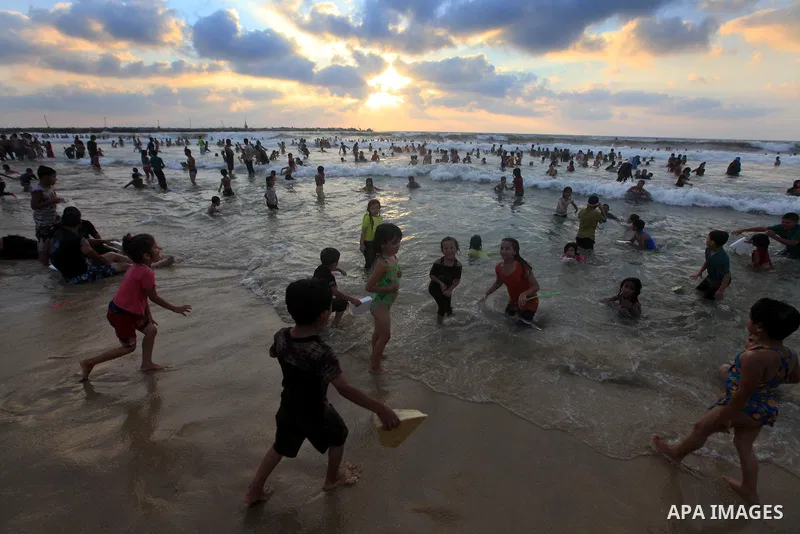 Palestinians enjoy swimming on their week-end in the Mediterranean sea in Gaza City on June 29, 2012. Photo by Majdi Fathi