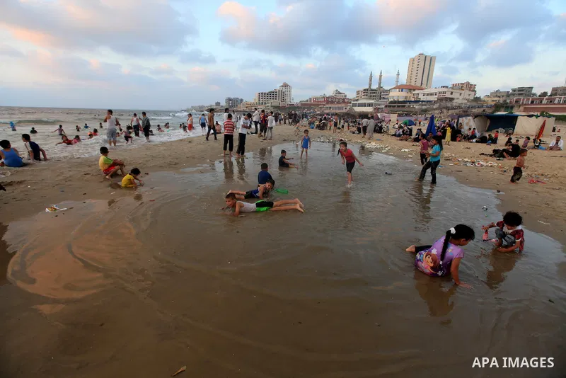 Palestinians enjoy swimming on their week-end in the Mediterranean sea in Gaza City on June 29, 2012. Photo by Majdi Fathi
