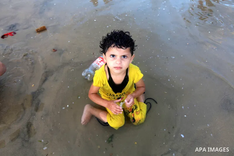 Palestinians enjoy swimming on their week-end in the Mediterranean sea in Gaza City on June 29, 2012. Photo by Majdi Fathi