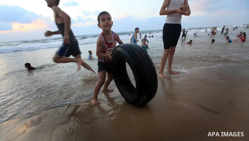 Palestinians enjoy swimming on their week-end in the Mediterranean sea in Gaza City on June 29, 2012. Photo by Majdi Fathi