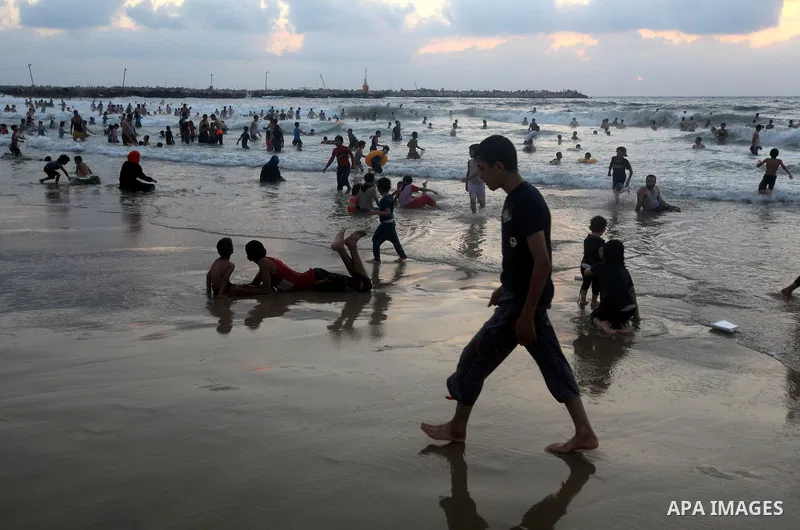 Palestinians enjoy swimming on their week-end in the Mediterranean sea in Gaza City on June 29, 2012. Photo by Majdi Fathi
