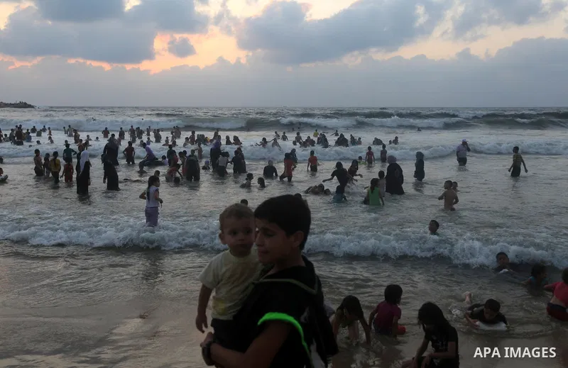 Palestinians enjoy swimming on their week-end in the Mediterranean sea in Gaza City on June 29, 2012. Photo by Majdi Fathi