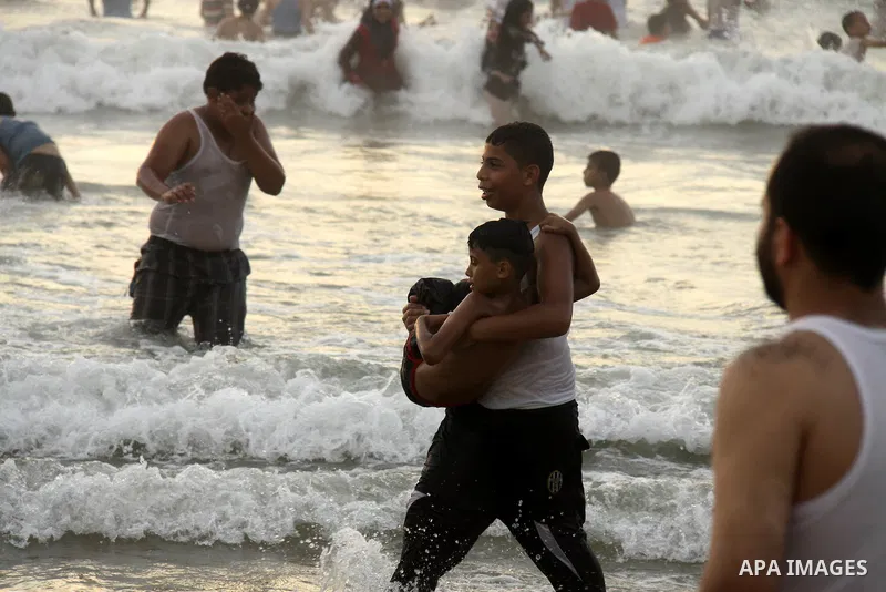 Palestinians enjoy swimming on their week-end in the Mediterranean sea in Gaza City on June 29, 2012. Photo by Majdi Fathi