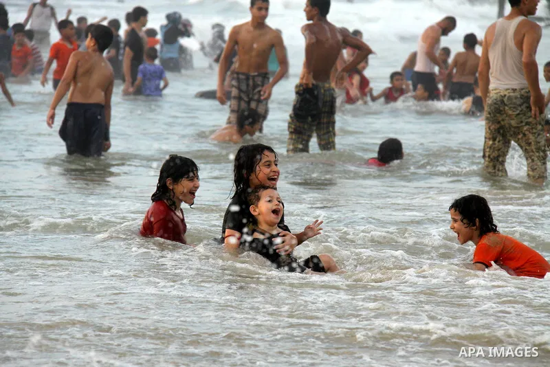 Palestinians enjoy swimming on their week-end in the Mediterranean sea in Gaza City on June 29, 2012. Photo by Majdi Fathi