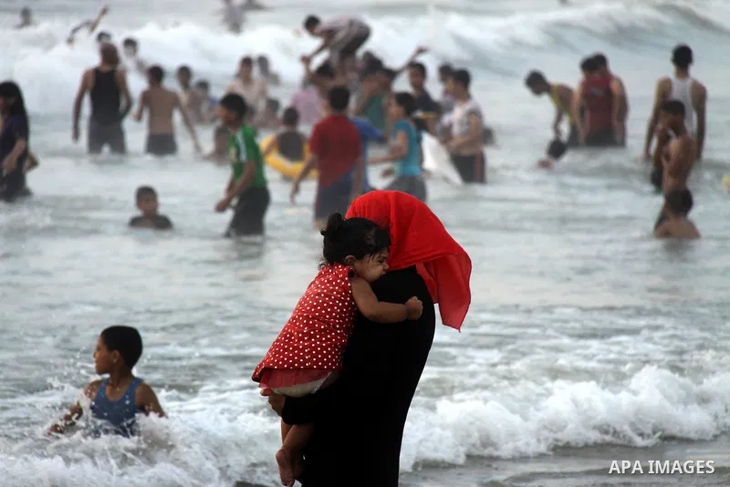 Palestinians enjoy swimming on their week-end in the Mediterranean sea in Gaza City on June 29, 2012. Photo by Majdi Fathi