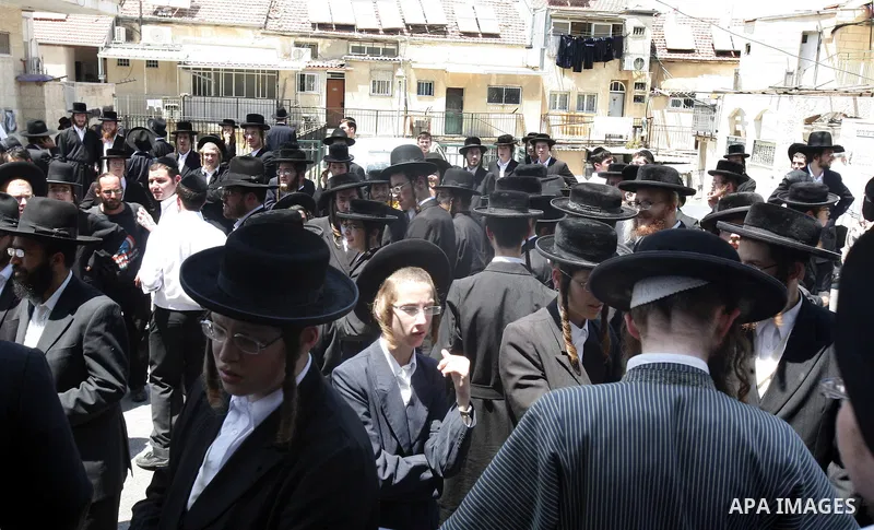 Ultra-Orthodox Jewish hold banners with slogans against involvement in the Israeli army during a protest in the west Jerusalem, on 01 July 2012. Photo by Mahfouz Abu Turk