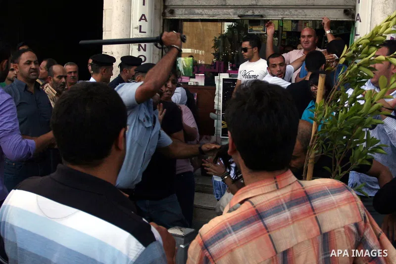 Palestinian Policemen block protesters from reaching the Palestinian presidential headquarters in the West Bank city of Ramallah, during a protest in the town, on 01 July 2012. Demonstrators protested against a scheduled...