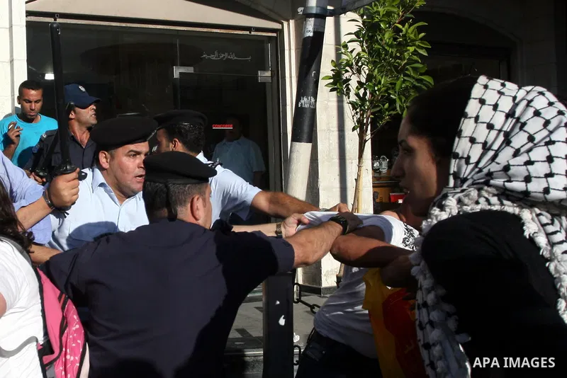 Palestinian Policemen block protesters from reaching the Palestinian presidential headquarters in the West Bank city of Ramallah, during a protest in the town, on 01 July 2012. Demonstrators protested against a scheduled...