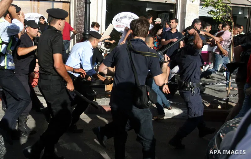 Palestinian Policemen block protesters from reaching the Palestinian presidential headquarters in the West Bank city of Ramallah, during a protest in the town, on 01 July 2012. Demonstrators protested against a scheduled...