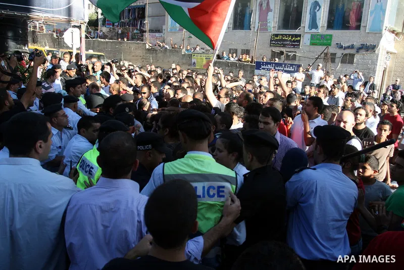 Palestinian Policemen block protesters from reaching the Palestinian presidential headquarters in the West Bank city of Ramallah, during a protest in the town, on 01 July 2012. Demonstrators protested against a scheduled...