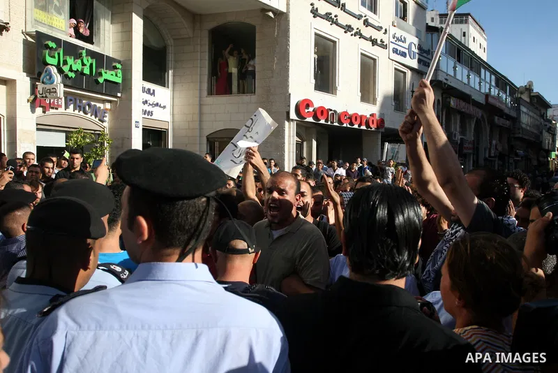 Palestinian Policemen block protesters from reaching the Palestinian presidential headquarters in the West Bank city of Ramallah, during a protest in the town, on 01 July 2012. Demonstrators protested against a scheduled...