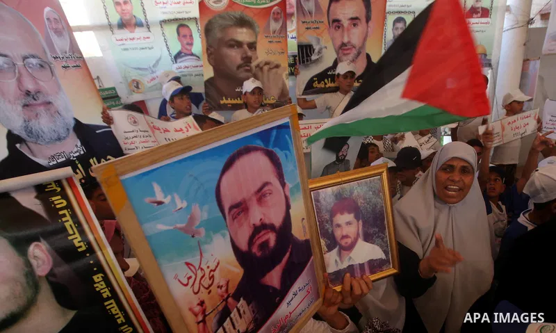 Palestinians gather during a protest in front of the Red Cross' offices in Gaza City to calling of release of palestinian prisoners on July, 02, 2012. Photo by Majdi Fathi