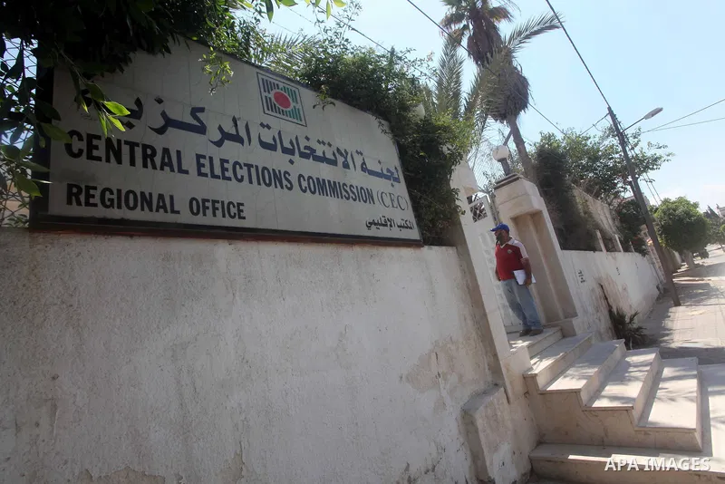 A Palestinian man stands near the Central Elections Commission (CEC) headquarters in Gaza city on July. 03,2012. Photo by Ashraf Amra