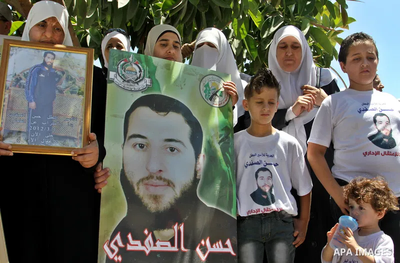Palestinians gather during a protest in front of the Red Cross' offices in West Bank city of Nablus calling of release of palestinian prisoners on July, 04, 2012. Photo by Nedal Eshtayah