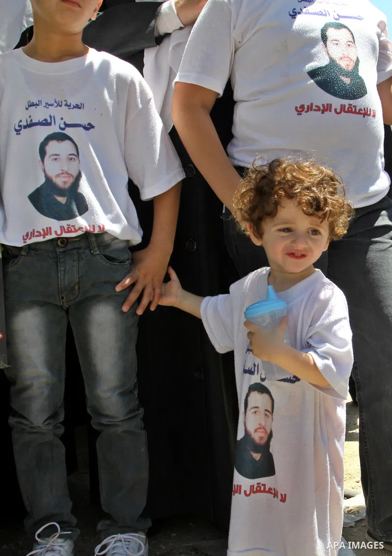 Palestinians gather during a protest in front of the Red Cross' offices in West Bank city of Nablus calling of release of palestinian prisoners on July, 04, 2012. Photo by Nedal Eshtayah